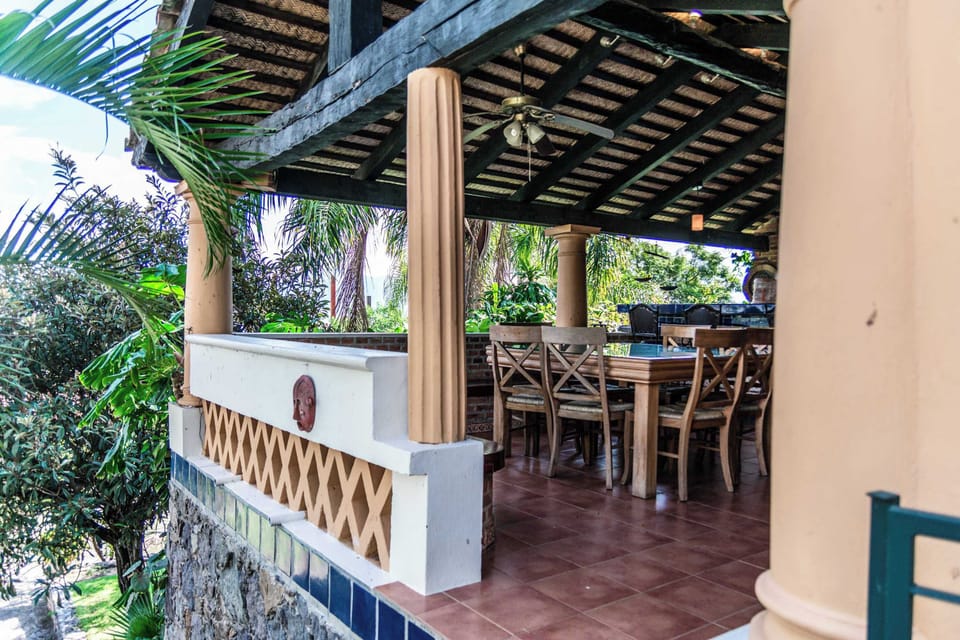 Outdoor Kitchen | Prepare meals in style with a fully equipped Mexican-inspired kitchen
