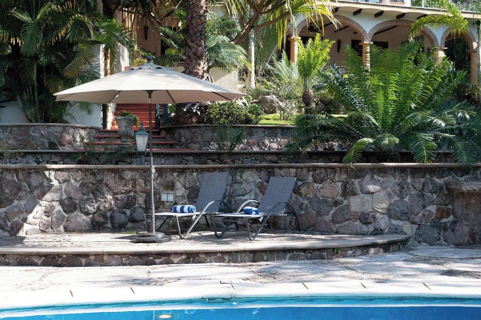 Sun Loungers | Poolside relaxation with scenic vistas and plush towels