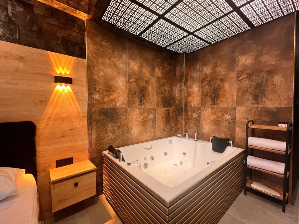 Deluxe Room, Hot Tub | Select Comfort beds, desk, laptop workspace, free WiFi