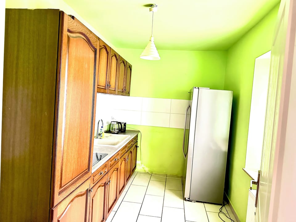 Mini-fridge, oven, stovetop, cookware/dishes/utensils