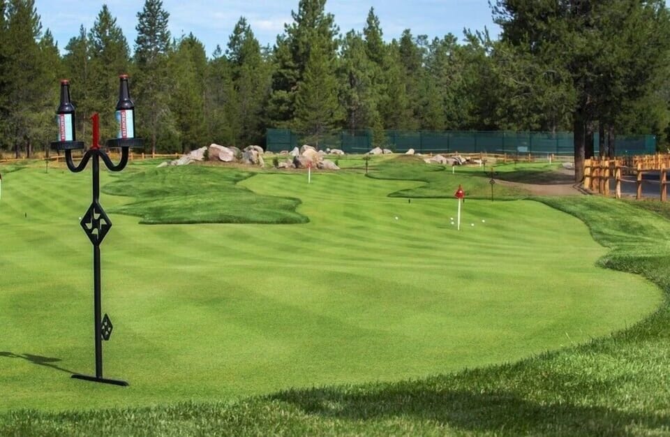 Pristine 18-hole golf course surrounded by towering pines and natural landscapes, perfect for golf enthusiasts seeking a challenging mountain retreat.