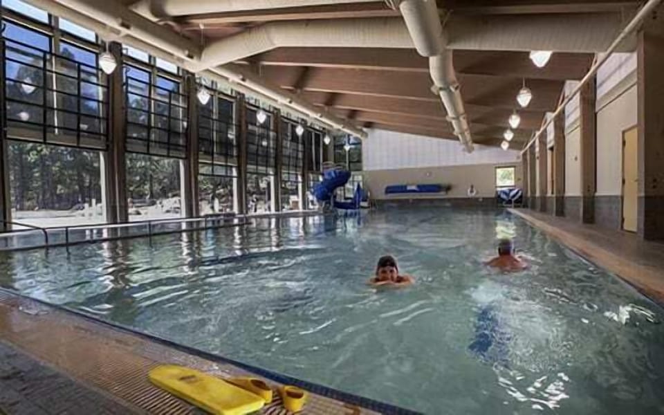 Dive into aquatic haven. Crystal-clear waters await your morning laps or leisurely afternoon float in this stunning indoor pool sanctuary.