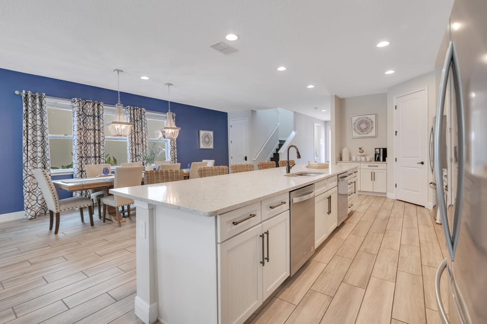 Modern kitchen with huge prep space and seating for everyone. Perfect for big family breakfasts before the parks!