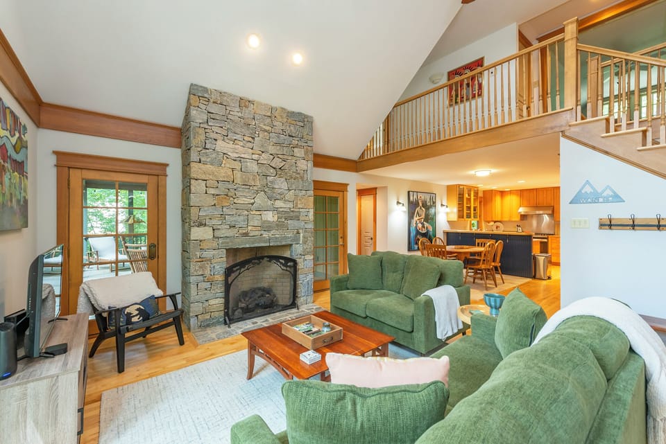 Living room with gas log fireplace and 42" TV for streaming