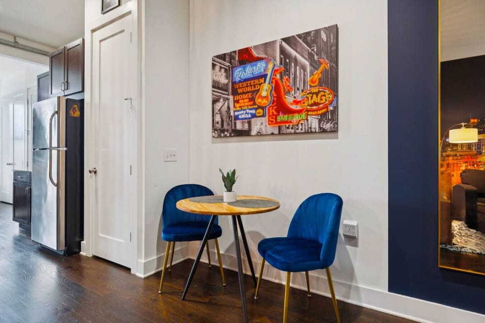 Two person dining area in addition to stool seating at the eat in kitchen