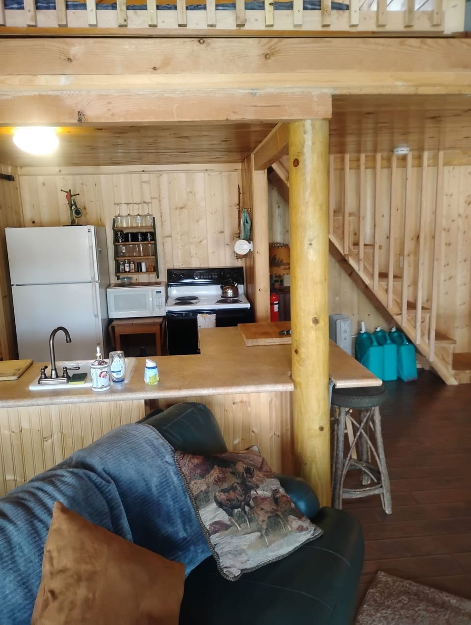 Kitchen has refrigerator, microwave, toaster,coffee maker, oven & stove