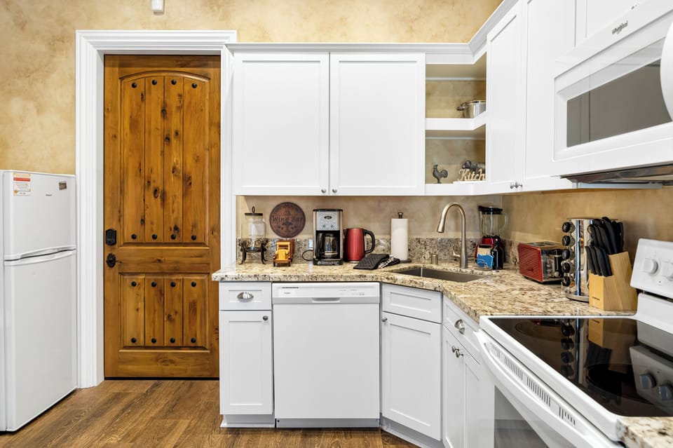 A compact kitchenette offers everything needed for easy meals.