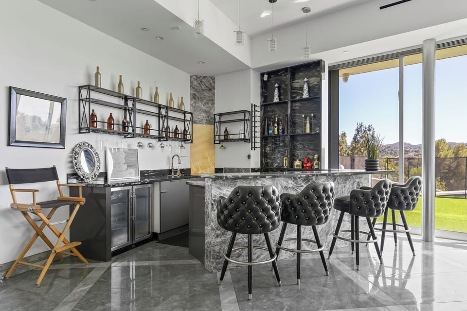 Raise a glass in the stylish bar area — perfect for cocktails and conversation.