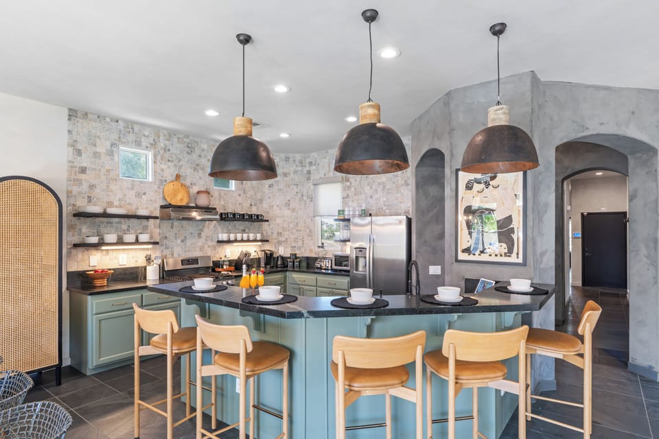 Cook up a storm in our sleek, modern kitchen with stylish barstool seating.