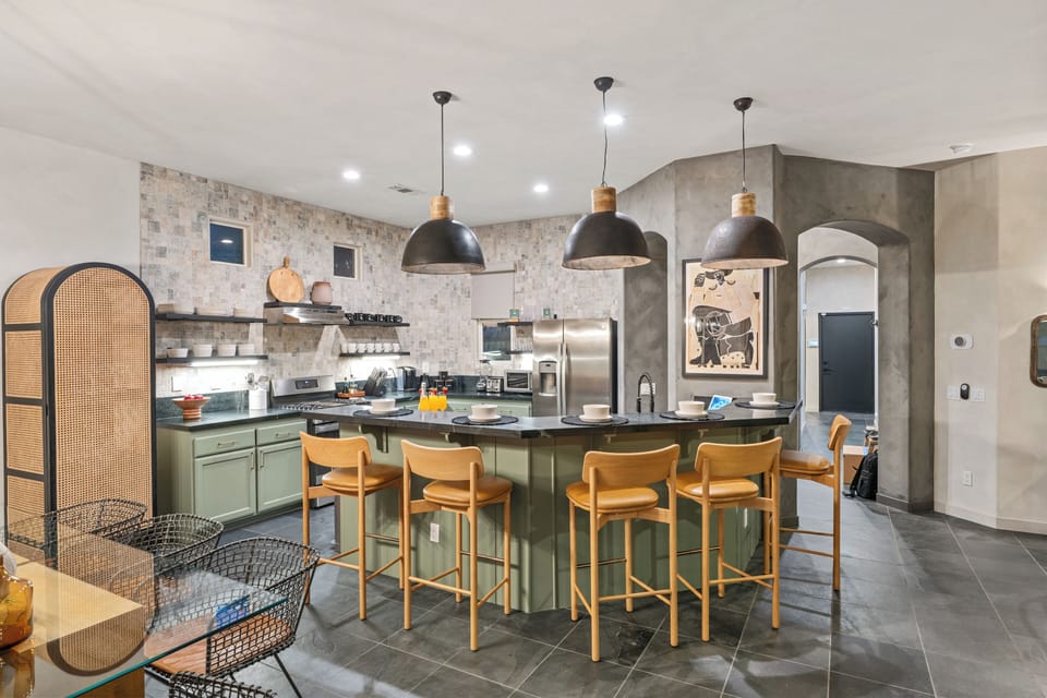 Sleek, modern kitchen with barstool seating.