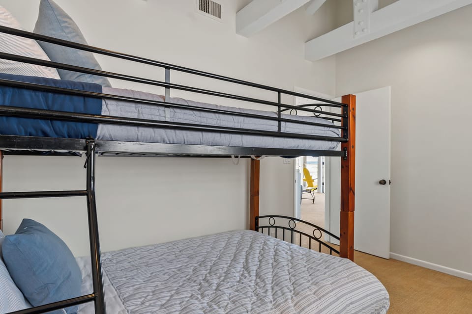 Bedroom 3 features a full bed over twin bunk bed.