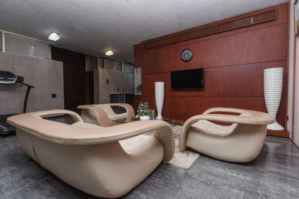 Luxury Apartment, Multiple Beds | Living area | 33-inch LED TV with satellite channels, printers