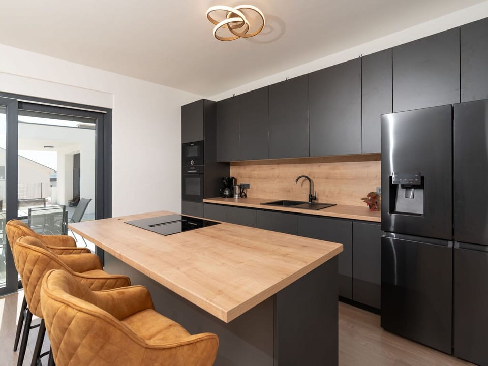 Furniture, Interior Design, Flooring, Countertop, Kitchen, Floor, Wood, Cabinetry, Wood Flooring, Ceiling