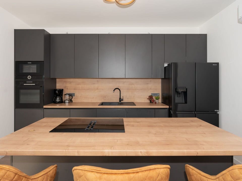 Furniture, Countertop, Flooring, Interior Design, Kitchen, Cabinetry, Wood, Floor, Kitchen Appliance, Wood Flooring