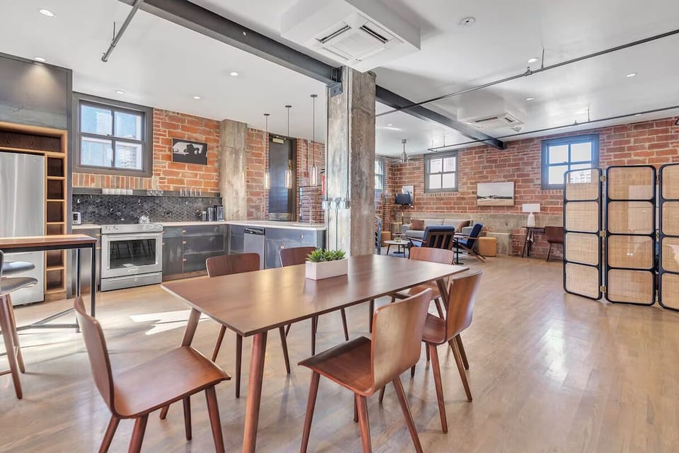 Host effortless dinners with a spacious table and modern kitchen.