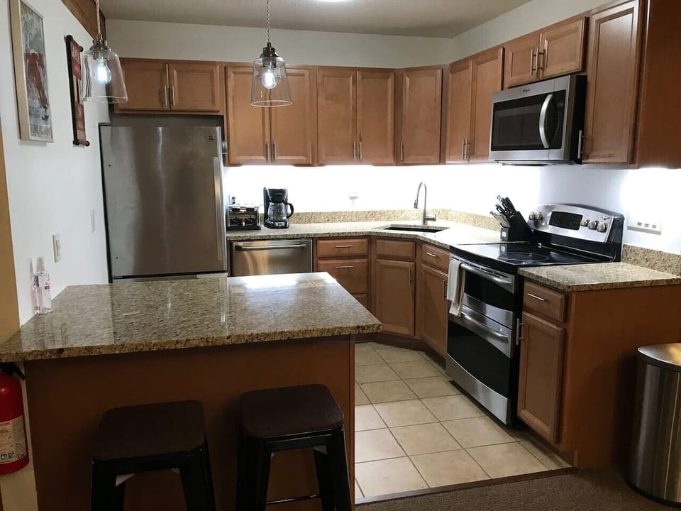Right side - Well-organized Stainless Steel & Granite kitchen.  If you like to cook, you are in the right place we have all of the pot`s, pans, baking sheet, muffin tins, cake pans, roasting pans you`ll need.  We also have loads of dry spices too.