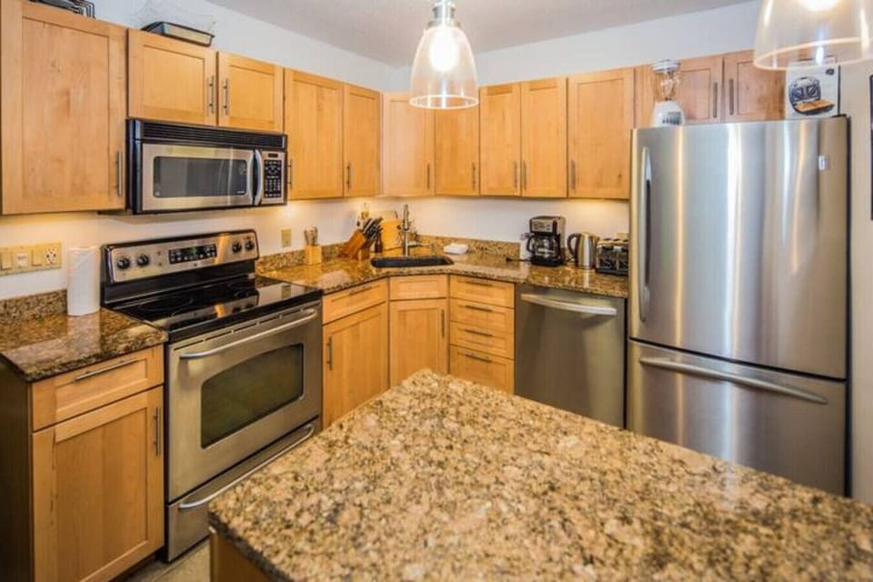 Left side - Stainless Steel & Granite kitchen.  If you like to cook, you are in the right place we have all of the pot`s, pans, baking sheet, muffin tins, cake pans, roasting pans you`ll need.  We also have loads of dry spices too.