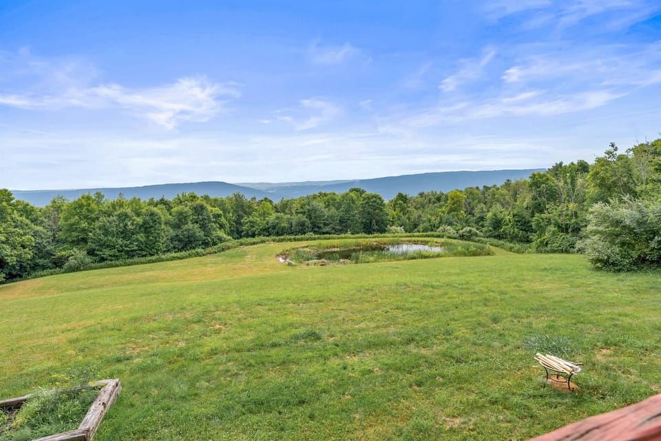 Soak in the sweeping mountain views and tranquil private pond—perfect for peaceful mornings and wildlife watching