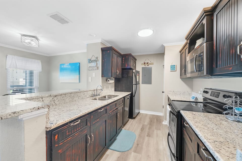 Your gourmet kitchen awaits with granite countertops, modern appliances, and ample space for creating memorable meals together.