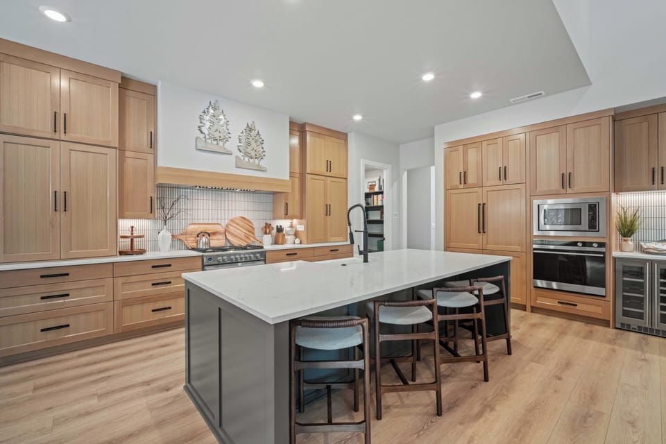 You'll love preparing meals in this chef's dream kitchen, with premium appliances and a spacious island perfect for gathering.
