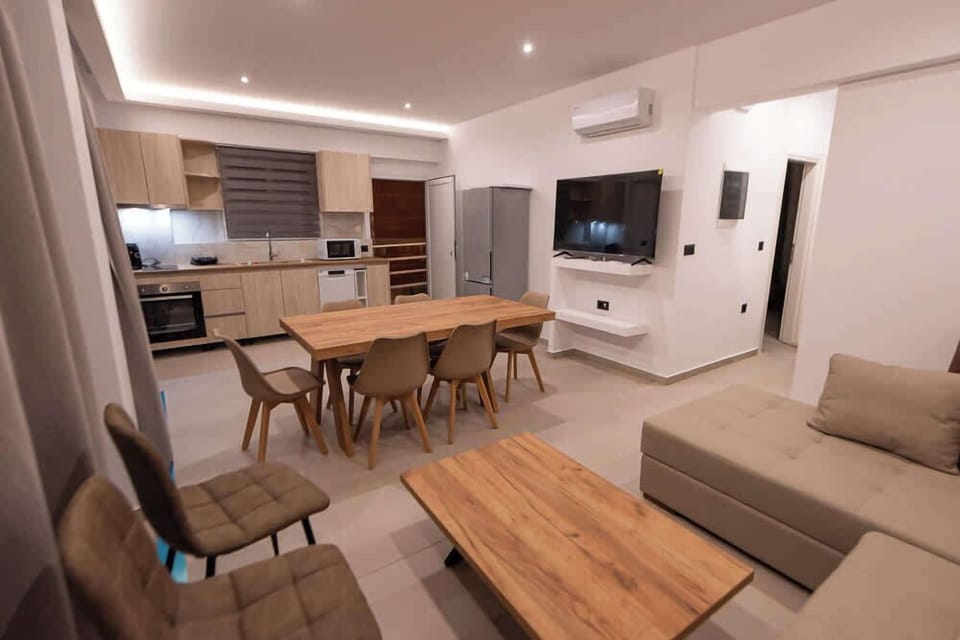 Modern Dining Space with Glass Doors to Terrace

