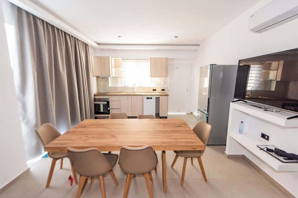 Stylish Open-Concept Living Area with Dining and Kitchen Space



