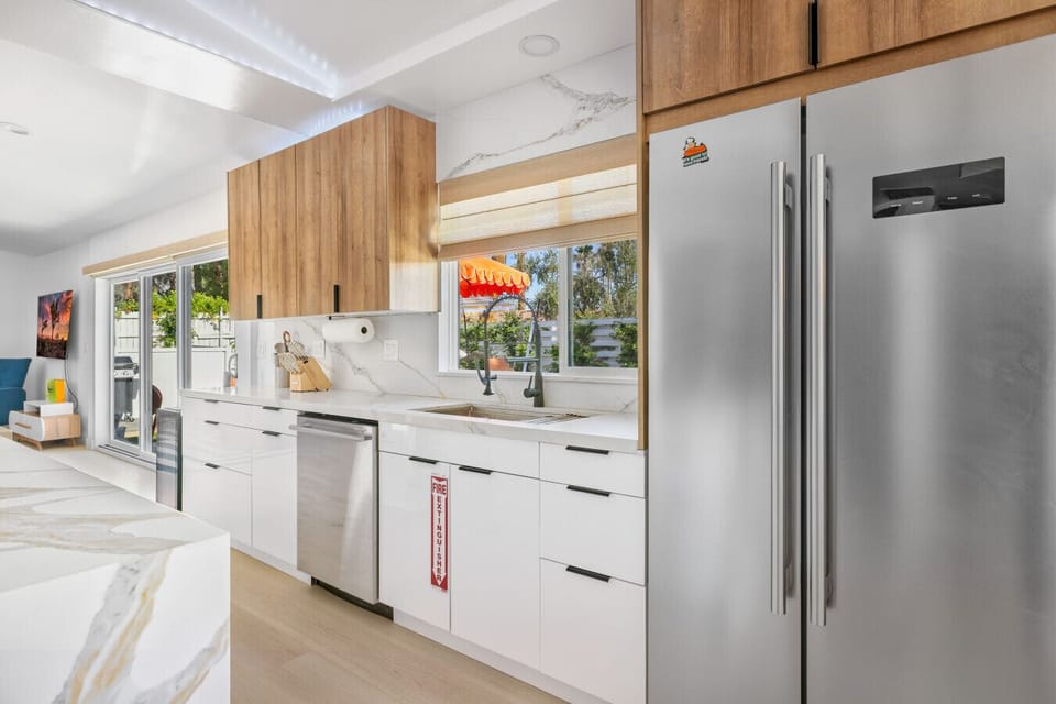 Sleek and fully stocked kitchen with modern appliances and ample counter space