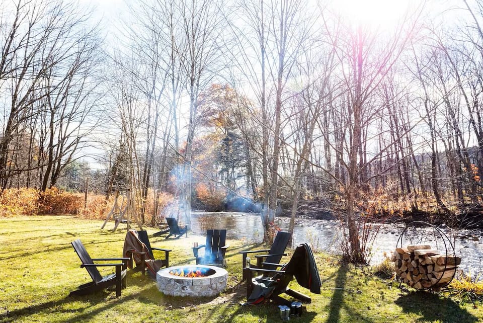 Relax by the riverside firepit under open, starry skies.