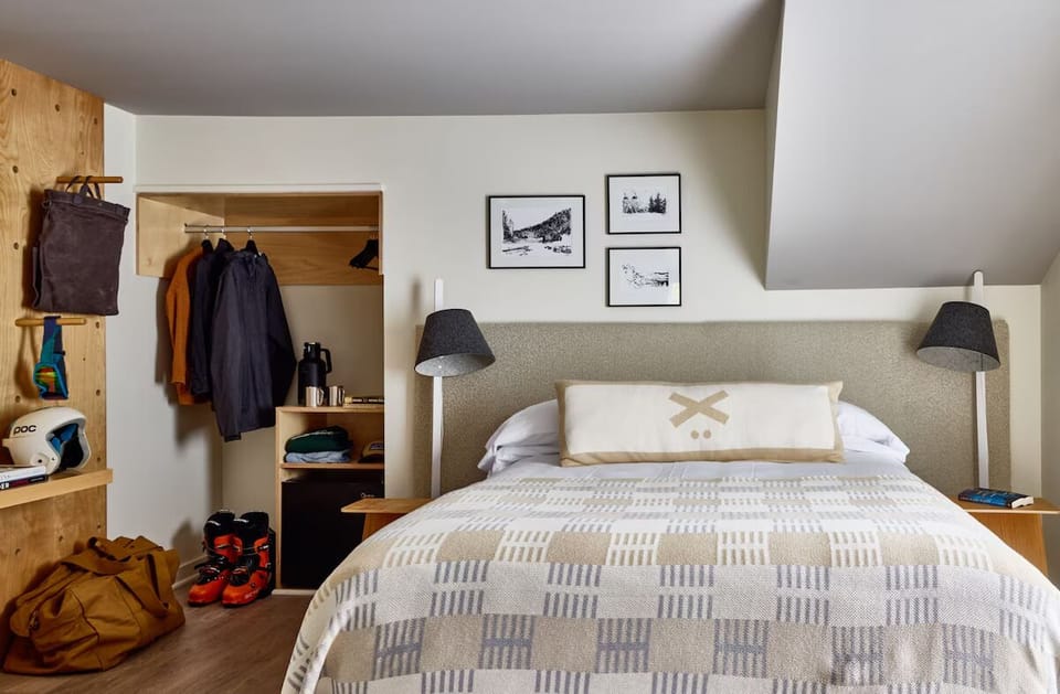 Recharge after adventure with bedside lamps and layered, cozy bedding