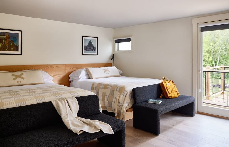 Wake up refreshed beside sunny doors opening to fresh air.