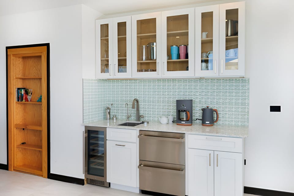 Brew morning coffee and snacks in the sleek kitchenette.