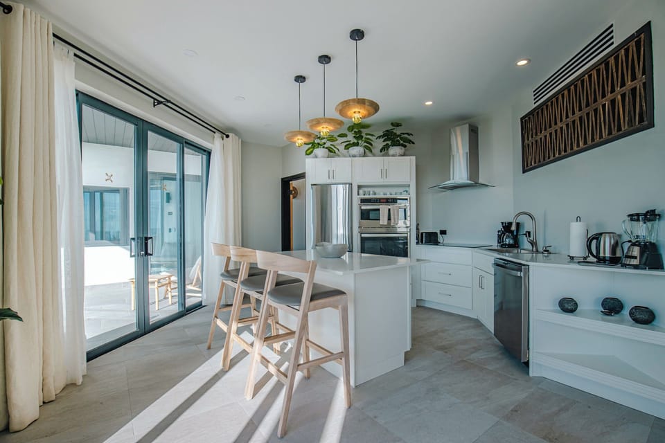 Gather around the sunlit island for coffee and conversation.