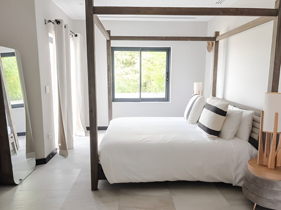 Unwind in airy canopy comfort with calming natural light.