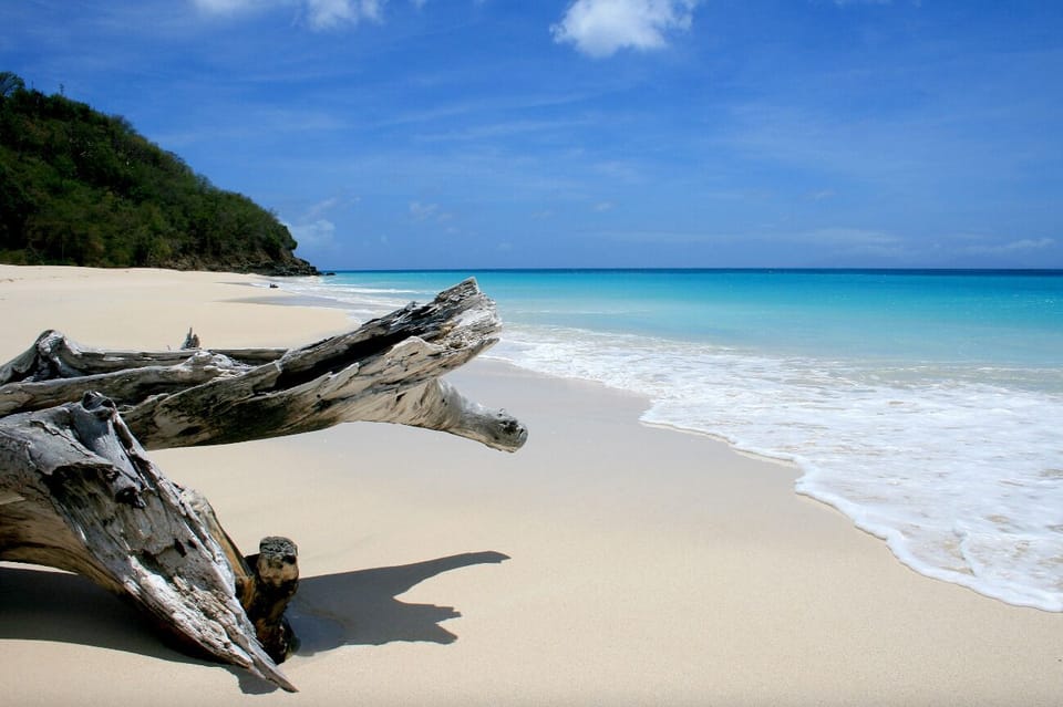 Wander pristine white sands and listen to gentle waves roll.