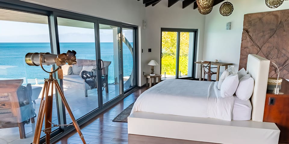 Wake up to sweeping ocean views from plush king bed.