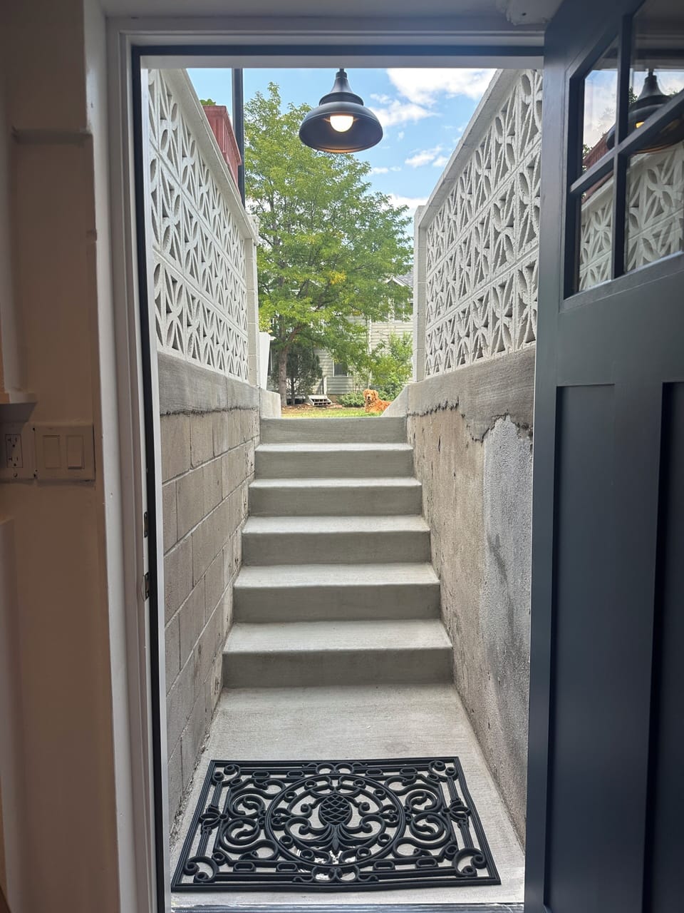 View from Entry room out private staircase to street.