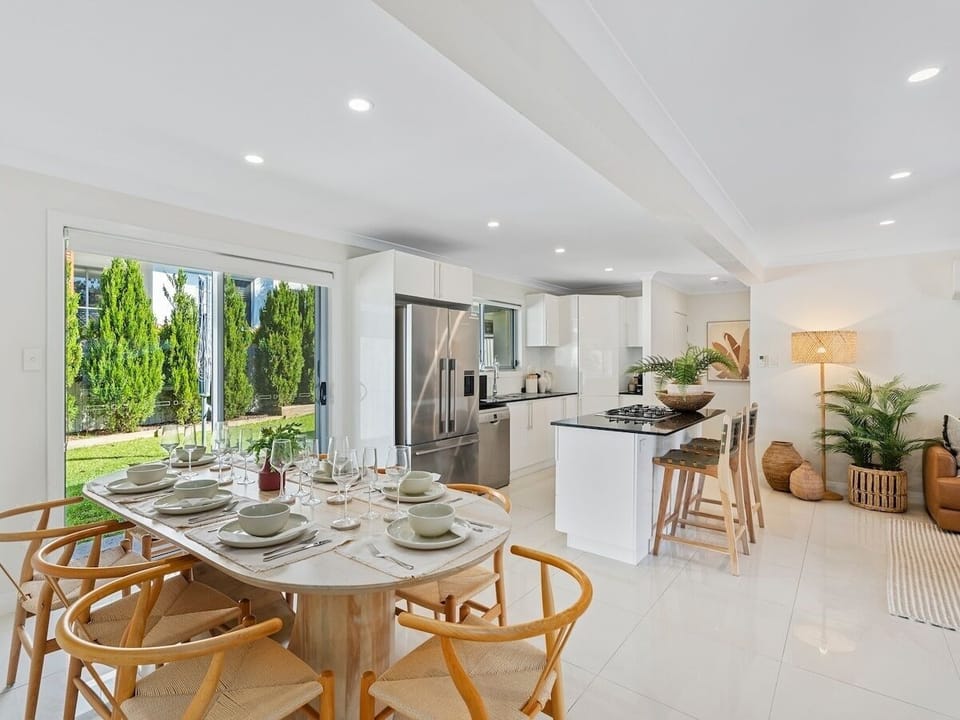 Kitchen with gas cooktop, dishwasher, Nespresso and stainless appliances.