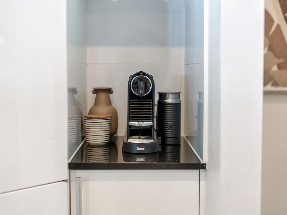 Kitchen with stainless appliances, gas cooktop, dishwasher and Nespresso.
