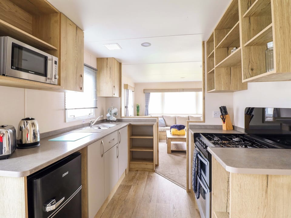 Fridge, microwave, toaster, cookware/dishes/utensils