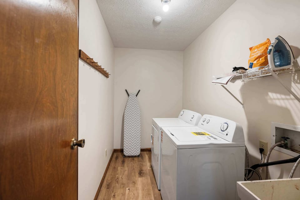 Private laundry is available for your stay, tucked away near the entryway​