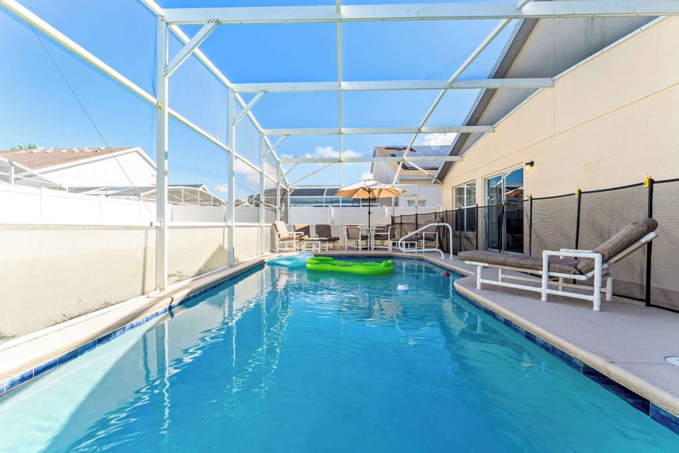 Private screened in pool with outdoor seating