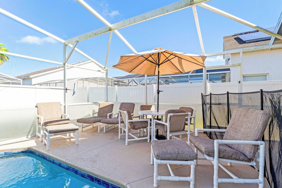 Private screened in pool with outdoor seating