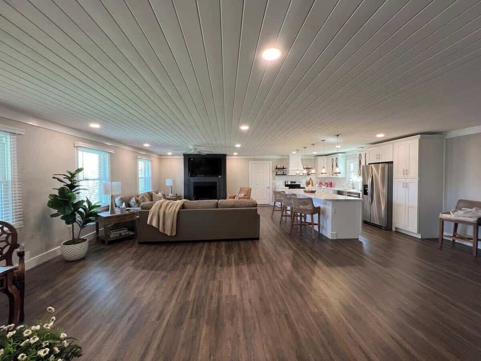 Guests will enter into the great room with large living area, dining area and fabulous kitchen! 