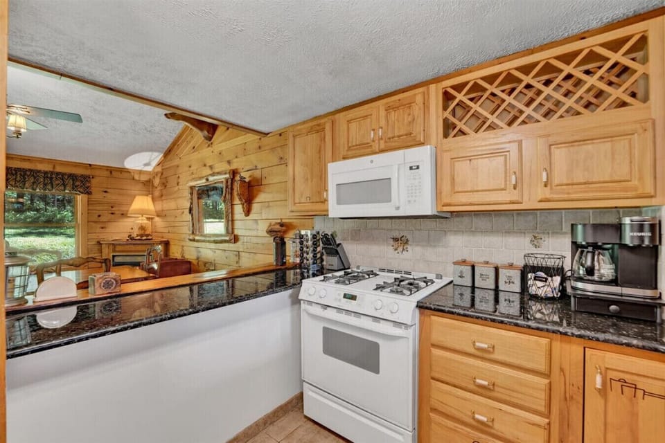 Bright and open kitchen and dining area featuring a peninsula—perfect for casual meals, extra prep space, or gathering with loved ones.
