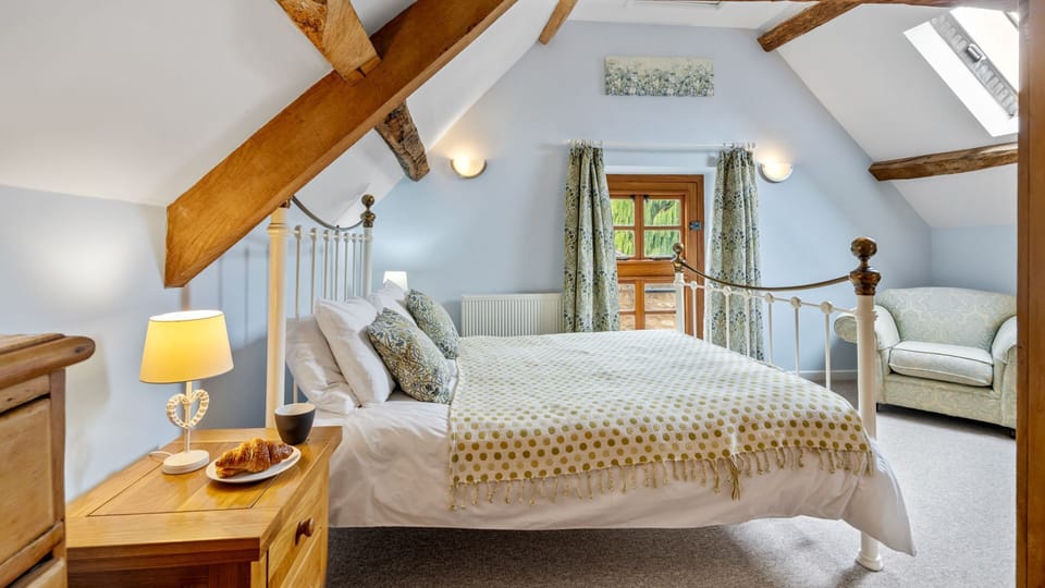 Bedroom one is light-filled and welcoming with cosy furnishings.