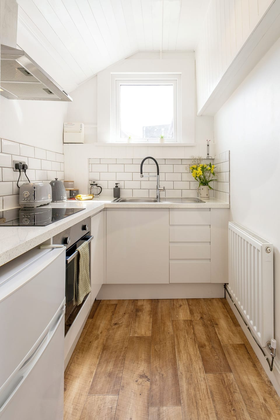 This kitchen features contemporary appliances, smart storage, and a clean, minimalist design.