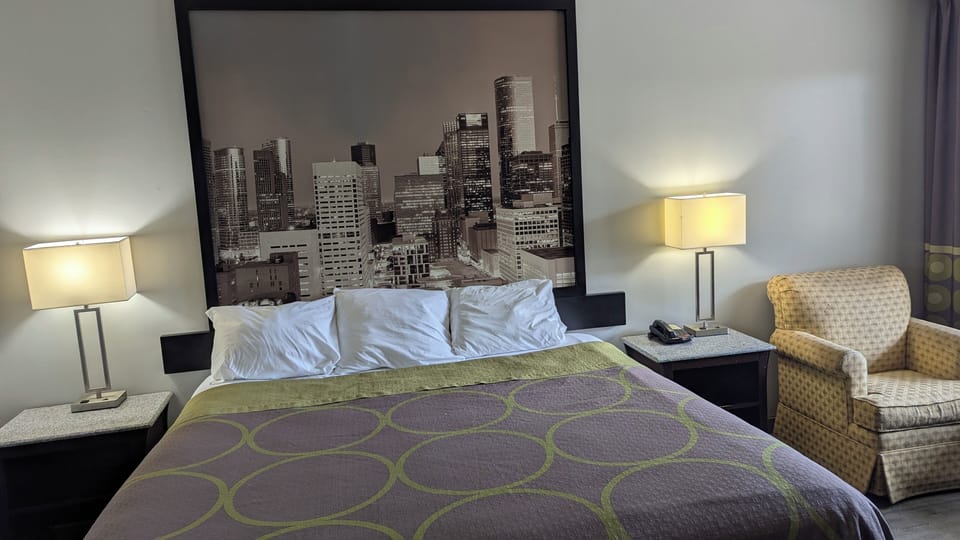 Desk, laptop workspace, blackout drapes, iron/ironing board