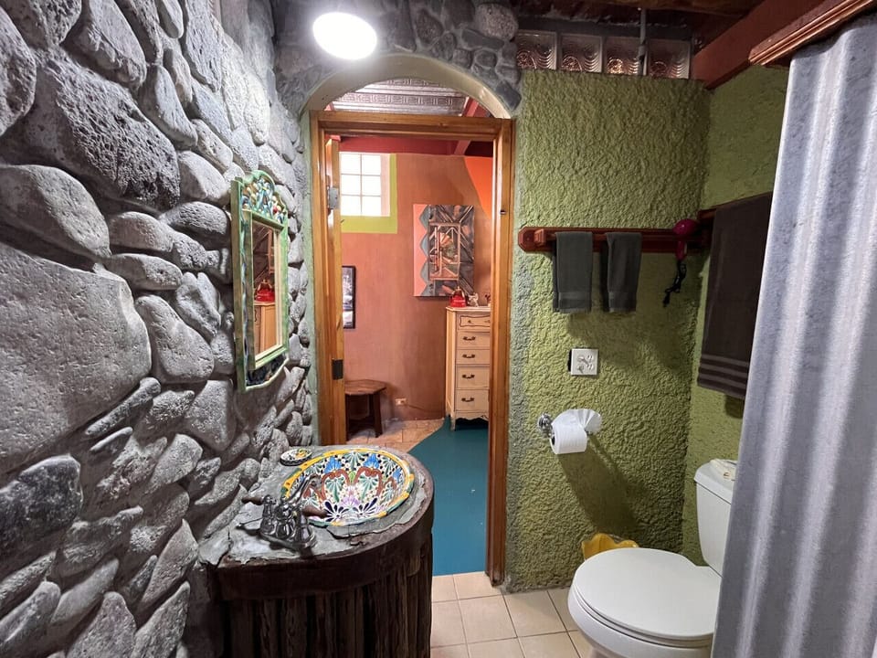 Unique, functional bathroom with vibrant Mexican flair