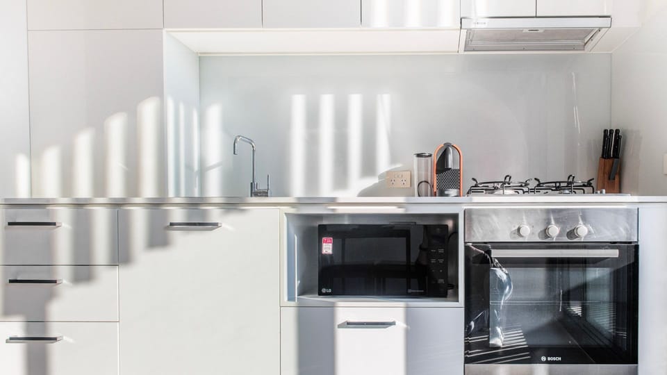 Compact yet fully equipped kitchen with a polished contemporary touch.