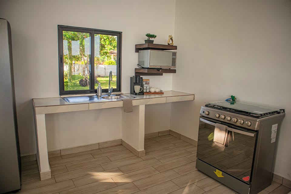 Full Gas Stove, Microwave, Sink, and Fridge